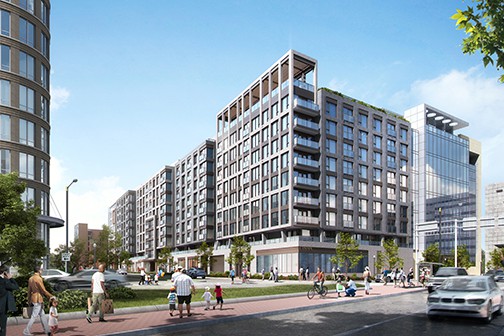 Large modern apartment building wraps around city street