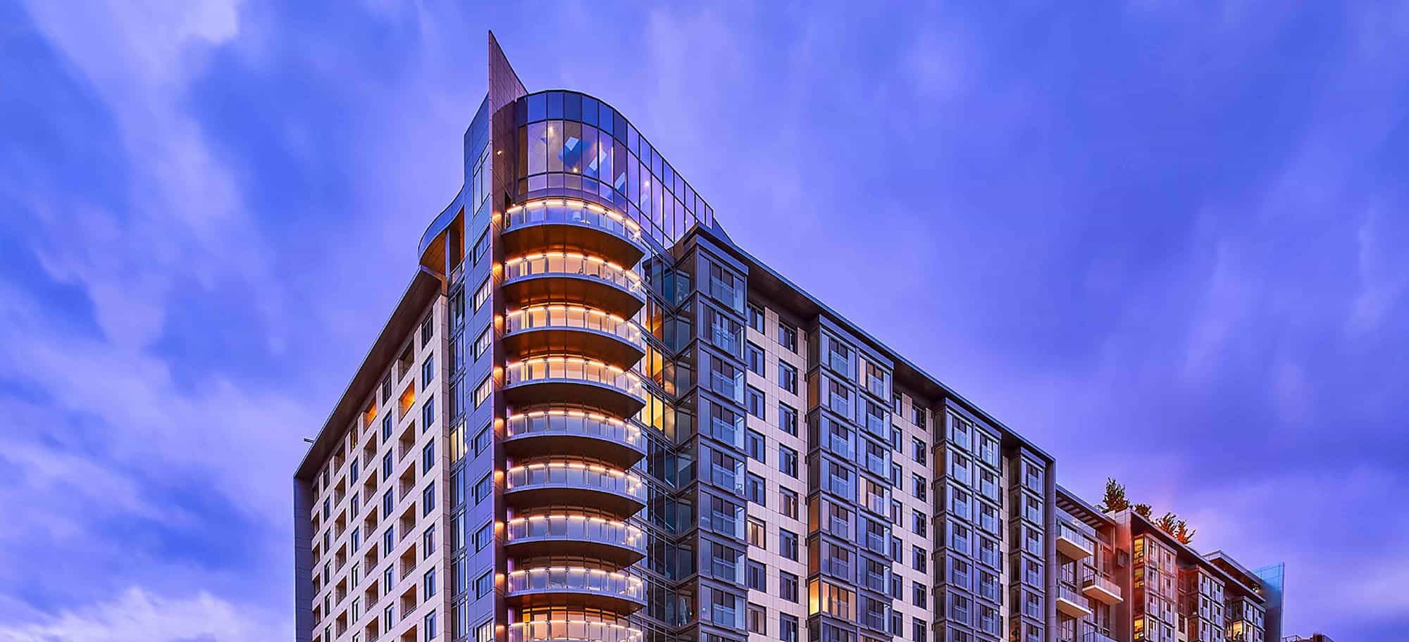 Upper penthouse floors of residential building at dusk