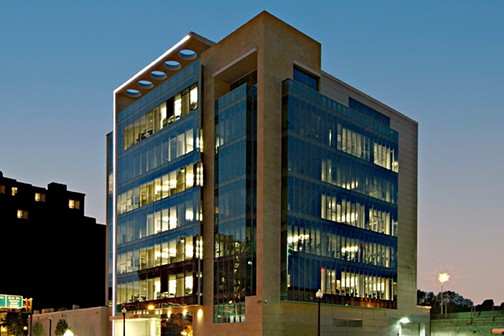 Modern building with decorative facade at dusk
