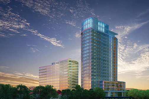 Aerial view of urban area surrounded by green space